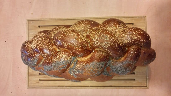 Uncovered challah loaves ready to be blessed and shared during the Shabbat meal
