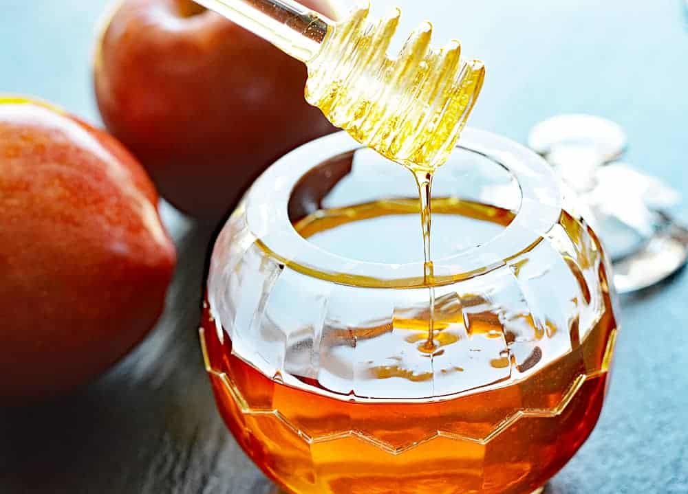 Apples and honey prepared for a Rosh Hashanah meal
