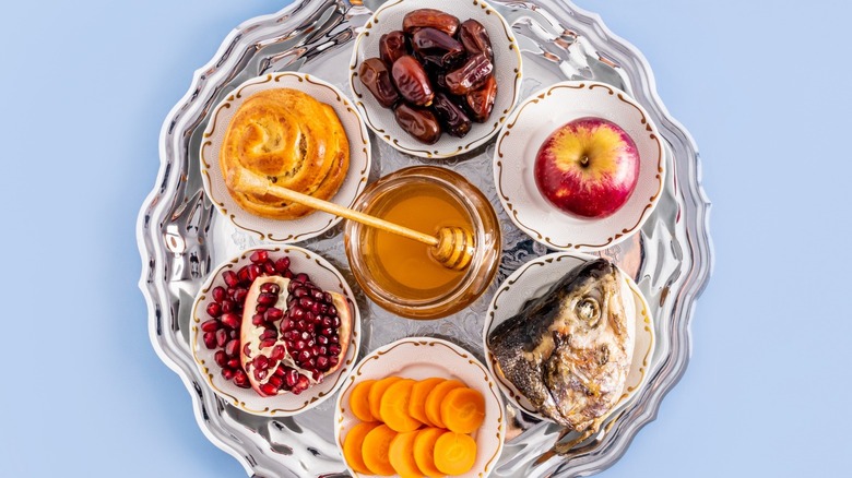 Rosh Hashanah table prepared with symbolic foods for the new year